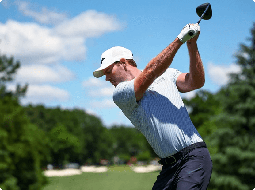 Professional golfer mid-swing